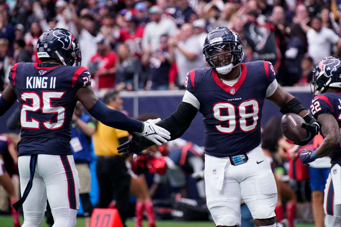 Texans defensive tackle Sheldon Rankins celebrates his touchdown off a ball fumbled by Tennessee Titans quarterback Will Levis during the second quarter at NRG Stadium in Houston, Texas